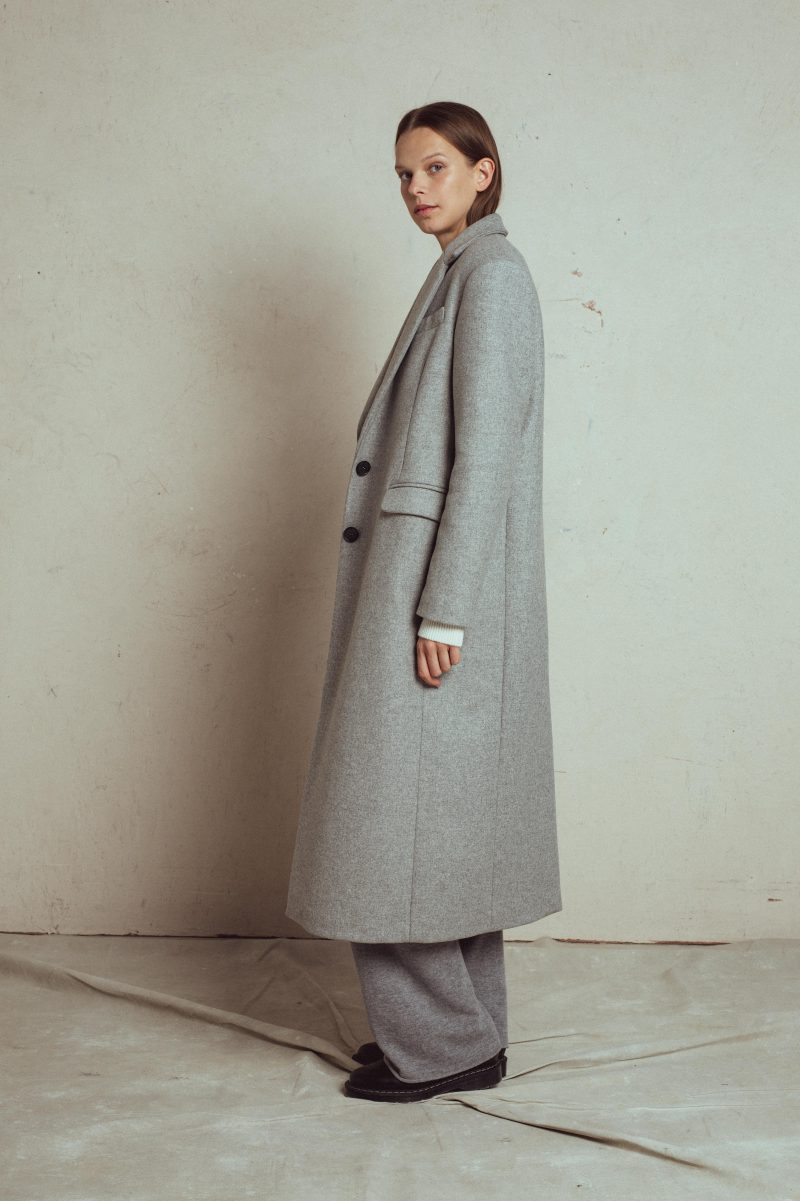 wool coat birla 2 from unlabel fall collection. classic men style silhouette with shoulder pads, satin lining, long slit at the back, with side pockets with flaps, front hidden buttons, italian stiff fabric 100% wool .