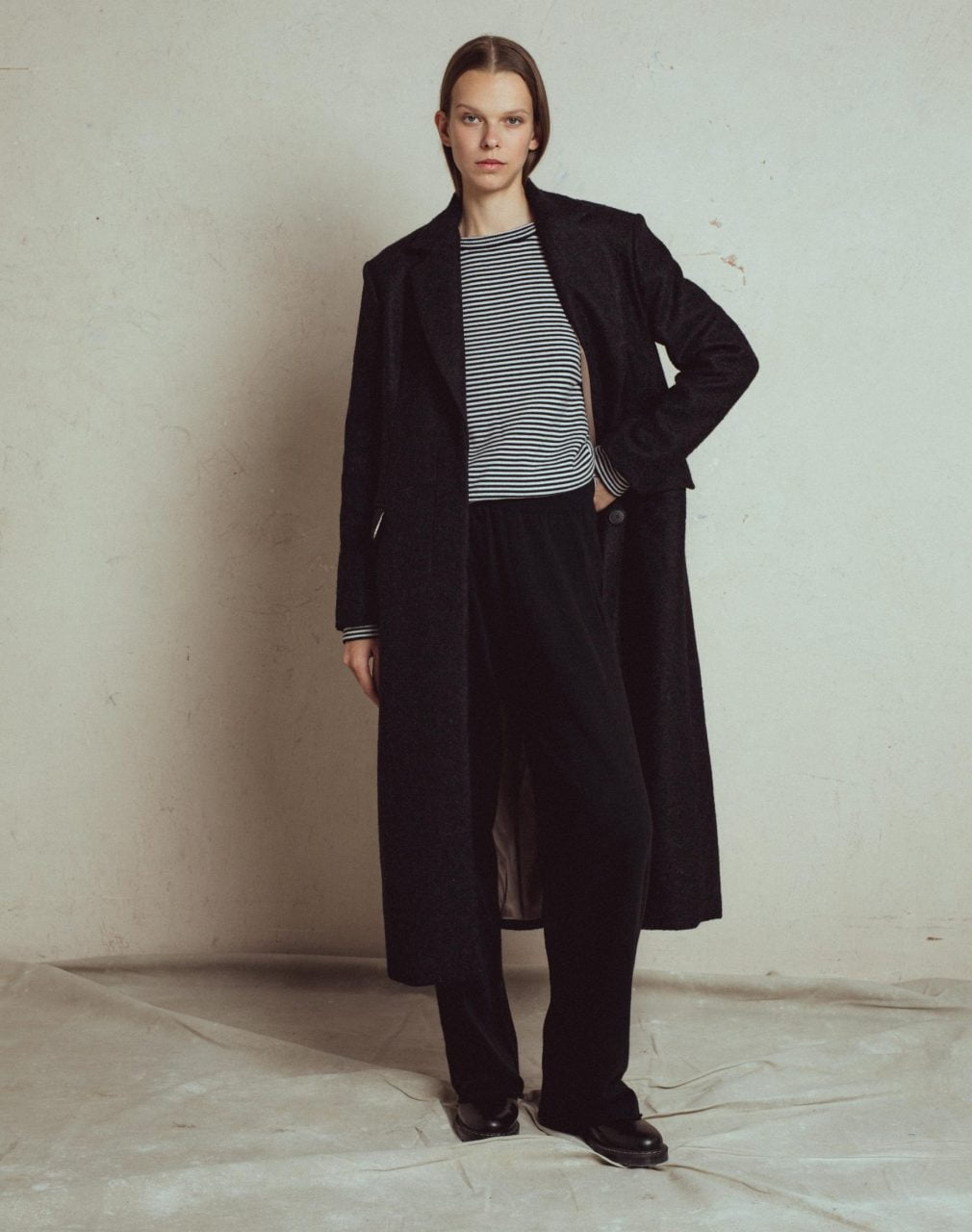 loose straight fit long coat bitter, classic men style silhouette with shoulder pads, satin lining, long slit at the back,  with side pockets with flaps, front hidden buttons.