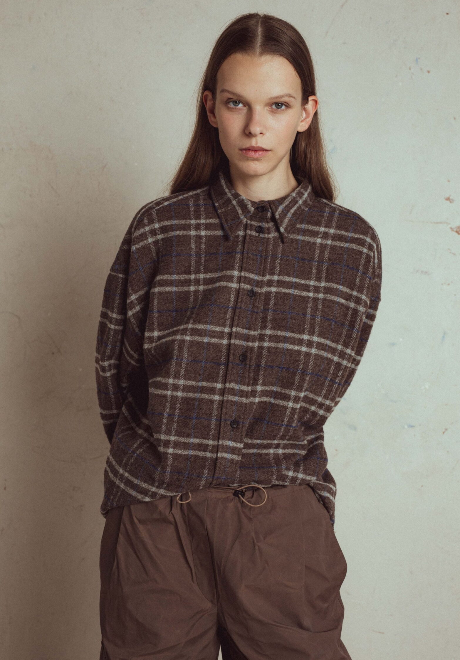 oversize men style shirt nosy from lithuanian brand unlabel. button fastening, below hip length, raw edge shirt bottom.