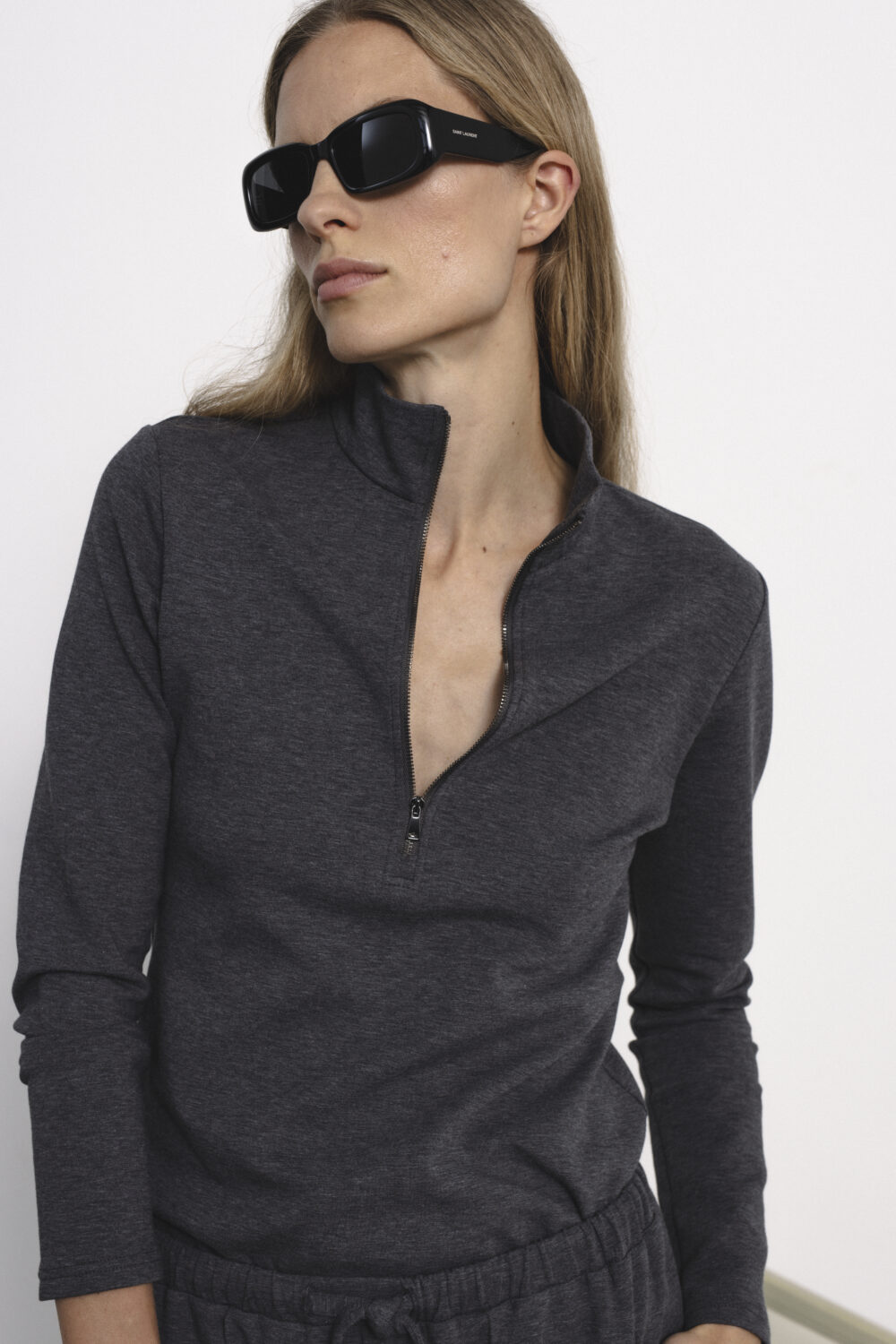 Women's clothing fashion. Demi zip top from unlabel f/w 25'26 collection. Minimalist style, modern design, premium quality womenswear. Made in Lithuania.