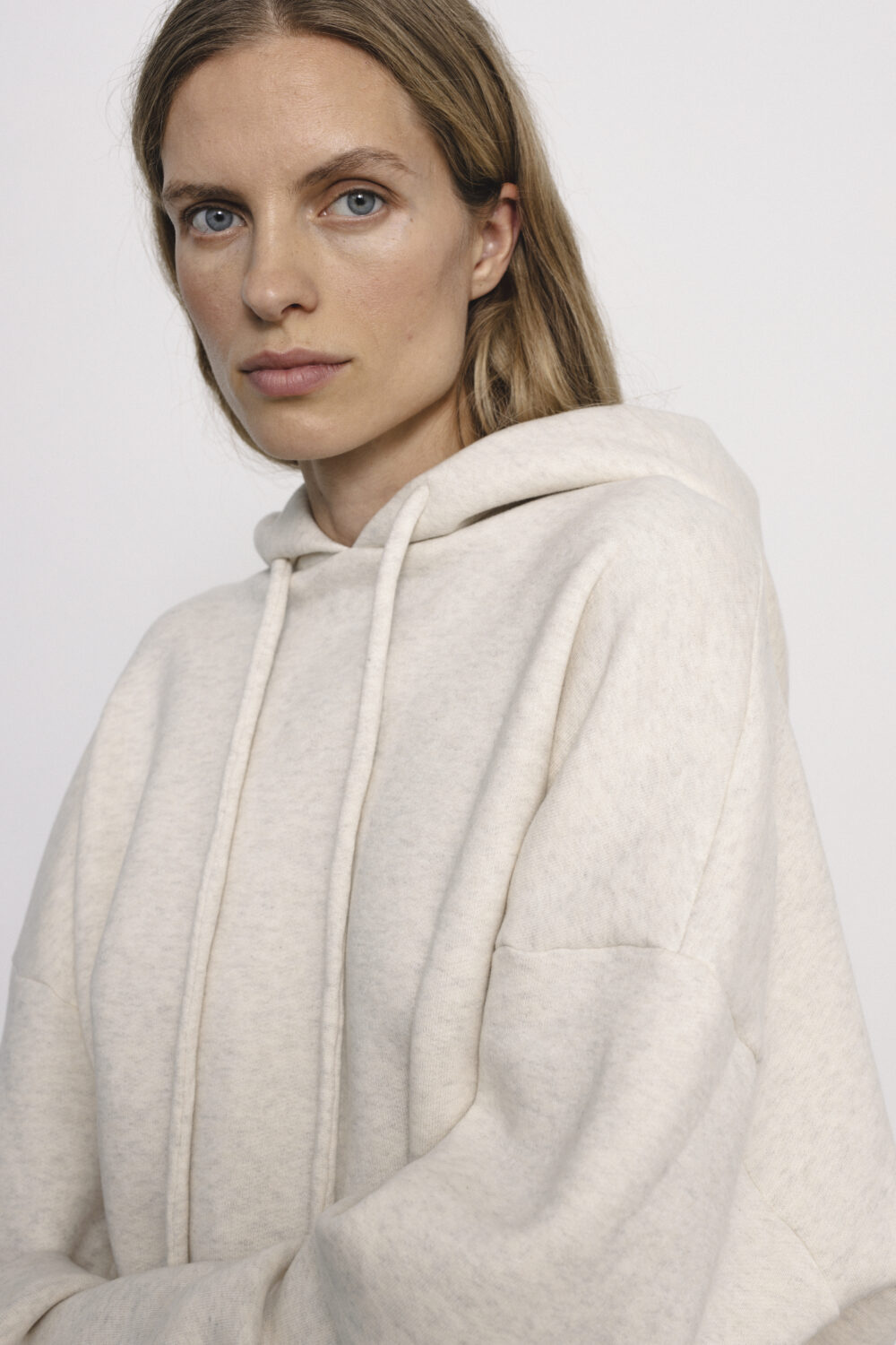 Women's clothing fashion. Sage hoodie from unlabel f/w 25'26 collection. Minimalist style, modern design, premium quality womenswear. Made in Lithuania.