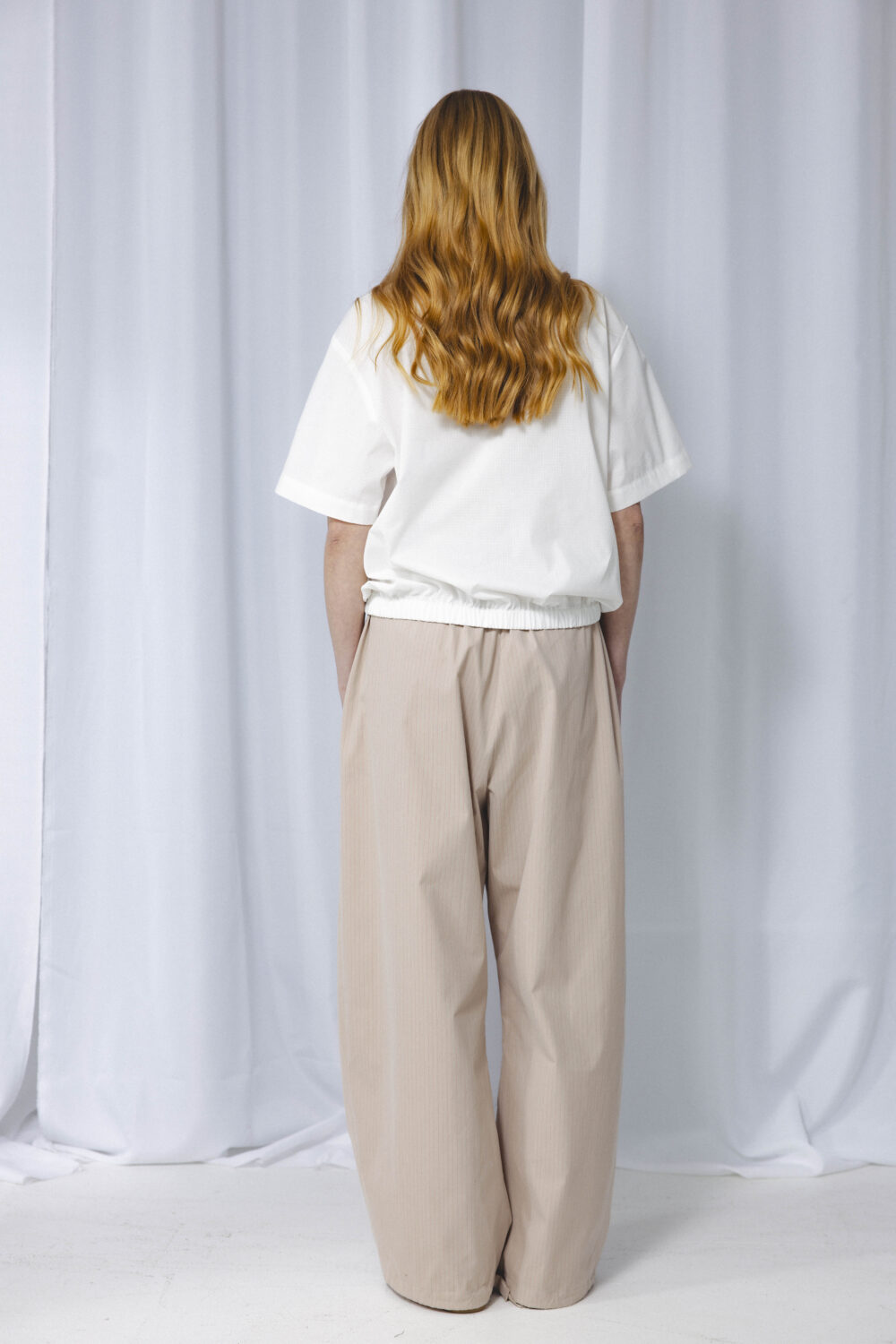 Women's clothing fashion. Lola pants from unlabel f/w 25'26 collection. Minimalist style, modern design, premium quality womenswear. Made in Lithuania.