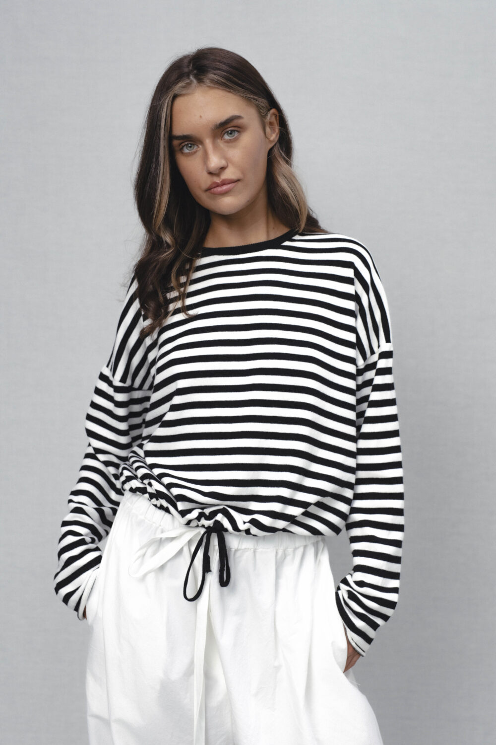 Women's clothing fashion. Nell1 sweater longsleeve stripes from unlabel ss/26 collection. Minimalist style, modern design, premium quality womenswear. Made in Lithuania.