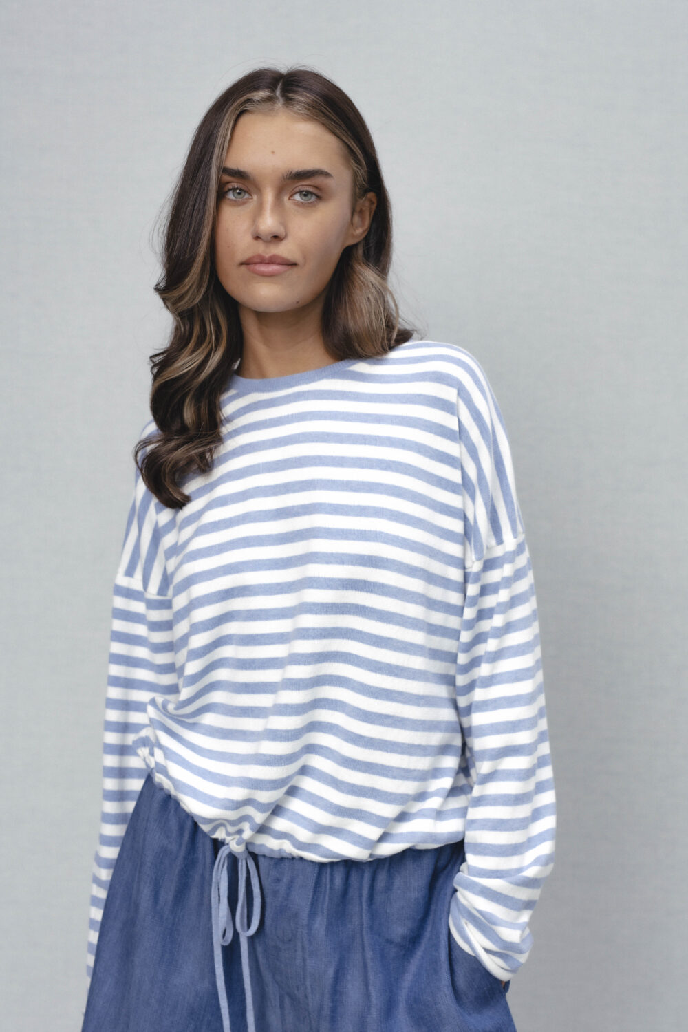 Women's clothing fashion. nell2 sweater longsleeve stripes from unlabel ss/26 collection. Minimalist style, modern design, premium quality womenswear. Made in Lithuania.